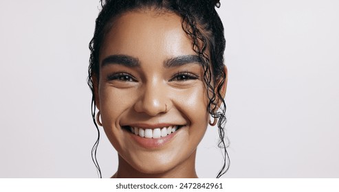 Portrait, woman and smile in studio for beauty, natural makeup and skincare on white background. Brazil girl, happiness and dermatology with care for treatment, skin glow and facial or spa therapy - Powered by Shutterstock