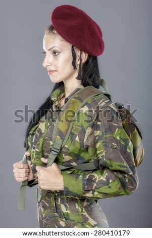 portrait of a woman soldier with backpack