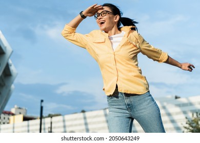 Portrait of woman squinting eyes and peering into distance, looking far away with attentive view, searching on horizon and curious to discover. Stock photo