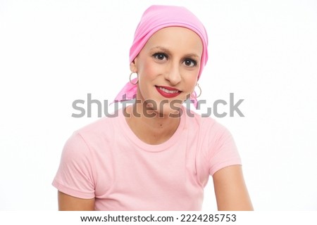 portrait of a woman suffering from breast cancer with pink handkerchief on white background