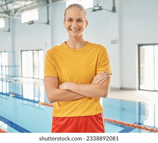 Portrait of woman, swimming pool and coach with arms crossed for exercise, fitness workout or sport. Face, swim and confident athlete, personal trainer or lifeguard, body health and happy in Canada - Powered by Shutterstock