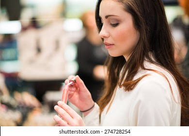 Portrait Of A Woman Trying A Product In A Beauty Shop