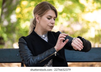 Portrait of a woman using her new smartwatch - Shutterstock ID 2276652379