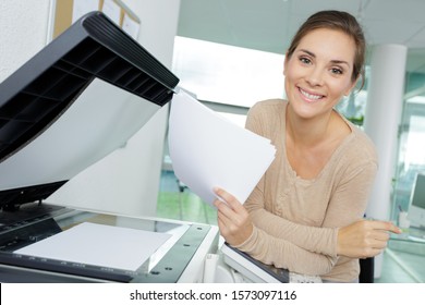 portrait of woman using office photocopier