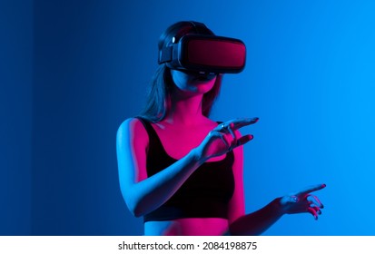 Portrait Of Woman Video Game Designer Wearing VR Headset And Interact With Virtual Environment Or Application.