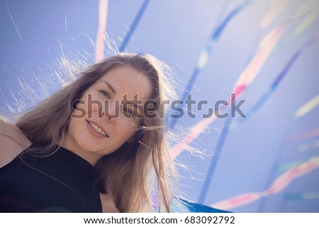 Similar – Young pretty woman in a pink blazer stands in front of an orange wall