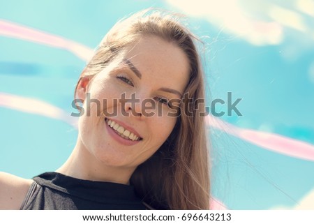 Similar – Young pretty woman in a pink blazer stands in front of an orange wall