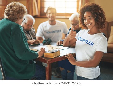 Portrait, woman or volunteer thumbs up with seniors in retirement home playing board game for community service. Teamwork, charity and people in group for helping hand and social responsibility - Powered by Shutterstock