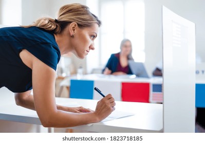 Portrait Of Woman Voter In Polling Place, Usa Elections Concept.