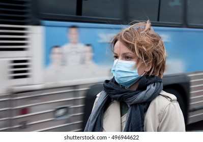 Portrait of woman walking on the street wearing protective mask as protection against infectious diseases. 
 - Shutterstock ID 496944622