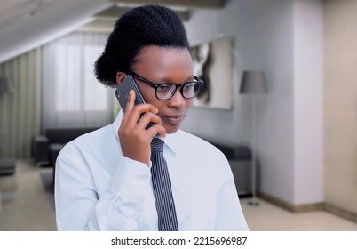 Portrait Of A Woman Wearing Glasses Talking On Phone. Woman Wearing Shirt And Neck Tie Making A Call. 