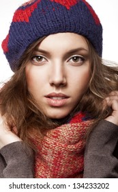Portrait of woman wearing woolen accessories, not isolated on white background