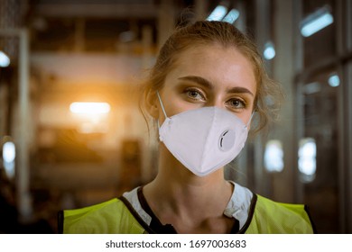 Portrait Woman Worker Under Inspection And Checking Production Process On Factory Station By Wearing Safety Mask Face To Protect For Pollution And Virus In Factory.