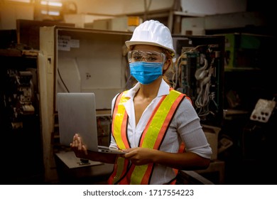 Portrait Woman Worker Under Inspection And Checking Production Process On Factory Station By Wearing Safety Mask To Protect For Pollution And Virus In Factory.