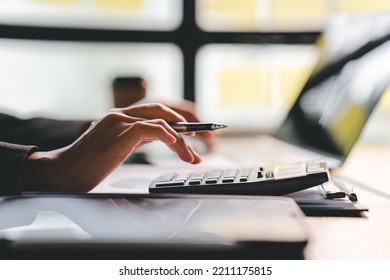 Portrait of a woman working on a tablet computer in a modern office. Make an account analysis report. real estate investment information financial and tax system concepts - Shutterstock ID 2211175815