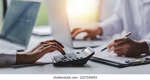 Portrait of a woman working on a tablet computer in a modern office. Make an account analysis report. real estate investment information financial and tax system concepts - Shutterstock ID 2227145053