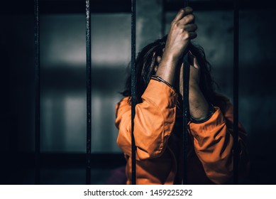 Portrait of women desperate to catch the iron prison,prisoner concept,thailand people,Hope to be free,If the violate the law would be arrested and jailed. - Shutterstock ID 1459225292