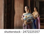 Portrait women in traditional clothing , Asia woman in Thai dress traditional women in traditional Dress on Buddhist on background.  Thai traditional in Ayutthaya Thailand.thai model portrait .