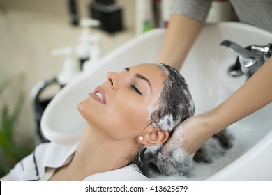 Portrait Of Women Which Wash Hair In A Beauty Salon