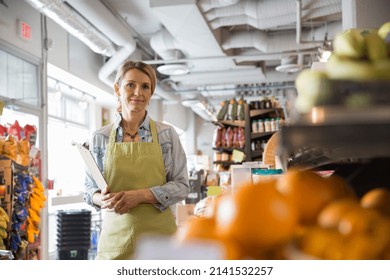 Portrait of worker with clipboard in market - Shutterstock ID 2141532257