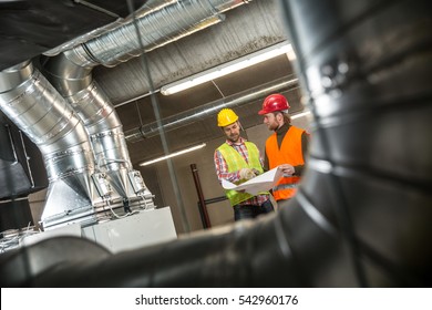 Portrait Of A Worker, Constructing And Checking Development Of A Small Business Hall. Reliable Civil Engineer Working On A Construction Site, Foreman At Work