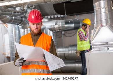 Portrait Of A Worker, Constructing And Checking Development Of A Small Business Hall. Reliable Civil Engineer Working On A Construction Site, Foreman At Work