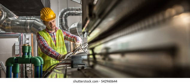 Portrait of a worker, constructing and checking development of a small business hall. Reliable civil engineer working on a construction site, foreman at work - Shutterstock ID 542960644