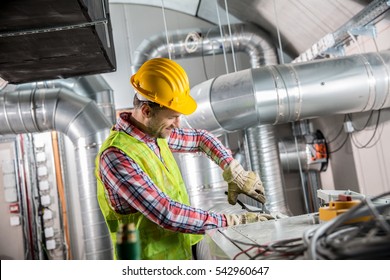 Portrait Of A Worker, Constructing And Checking Development Of A Small Business Hall. Reliable Civil Engineer Working On A Construction Site, Foreman At Work