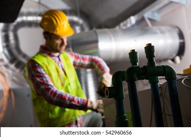 Portrait Of A Worker, Constructing And Checking Development Of A Small Business Hall. Reliable Civil Engineer Working On A Construction Site, Foreman At Work