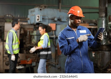 portrait worker or engineer working on tablet in the factory