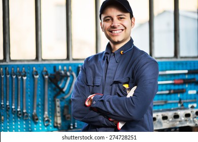 Portrait Of A Worker In Front Of His Tools