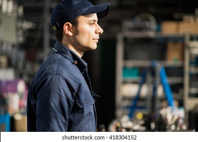 Portrait Of A Worker In His Factory