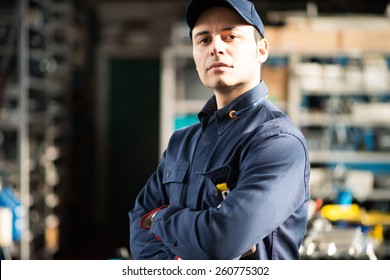 Portrait Of A Worker In His Shop