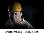 Portrait of the worker on a black background