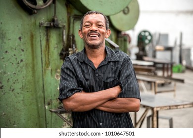 Portrait of Worker on Factory on background