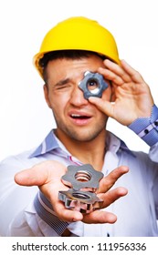 Portrait of worker posing in studio with screw