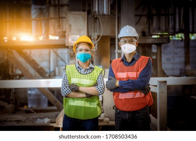 Portrait Worker Under Inspection And Checking Production Process On Factory Station By Wearing Safety Mask To Protect For Pollution And Virus In Factory.