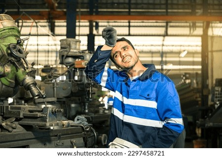 Portrait of workers, technicians, professional engineers, hats, tired from the stress of hot summer weather, production line, work and inspection, factory, machine, heavy industry production process.