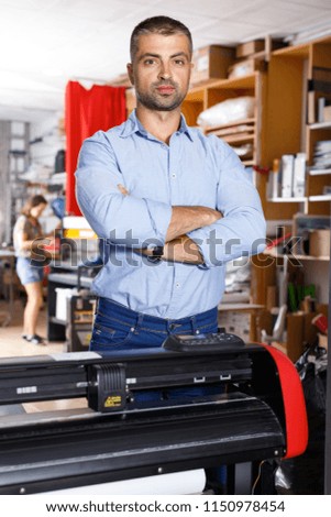 portrait of a working man at a printer studio