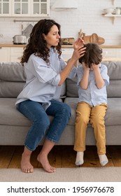 Portrait Of Worried Mother With Crying Son. Disturbed Young Mom Comfort Depressed Son. Frustrated Preschool Boy Receive Emotional And Physical Support From Caring Mum. Child Emotion And Parenthood