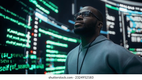 Portrait of Worried Professional Programmer Fixing a Bug, Dealing with Crashing System. Young Black Man Looking at Big Digital Screens Glitching While Displaying Code Lines, Thinking of Solutions - Powered by Shutterstock