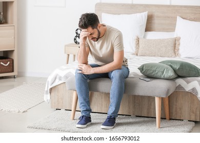 Portrait Of Worried Young Man At Home