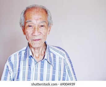 A Portrait Of A Wrinkly Old Balding Chinese Man.