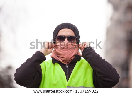 portrait of yellow vest political activist protesting on street