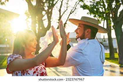 portrait young adult latin american couple dancing cueca national dance in huaso dress in the city square