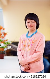 Portrait Of Young Adult Woman With Down's Syndrome