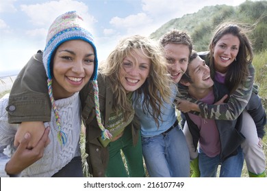 Portrait Of Young Adults At Beach