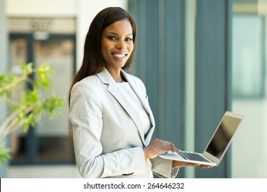 Portrait Of Young African American Business Woman With Laptop