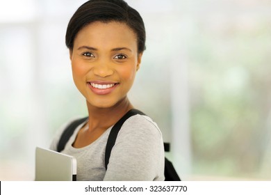 Portrait Of Young African American College Student Holding Laptop