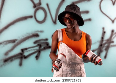 portrait young african american girl in hip hop style, background made by young artist painting with spray cans